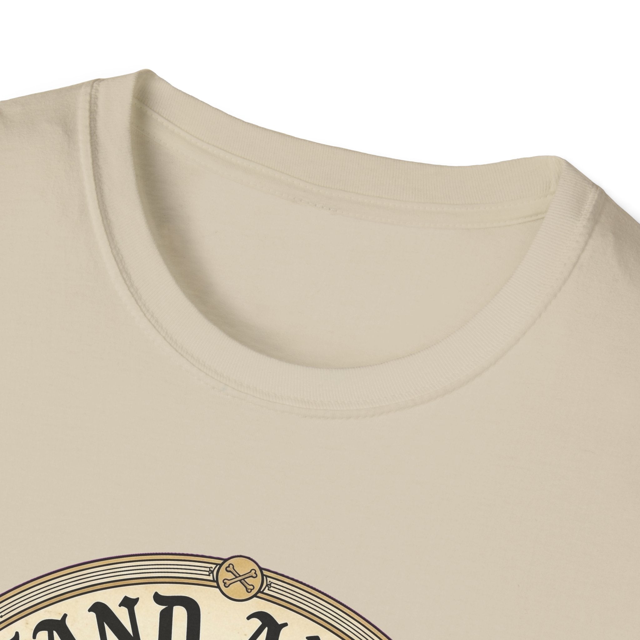 I Stand Amazed Golden Retriever T-Shirt close-up of the neckline on a sand shirt, showing the top arc of the circular golden retriever graphic.