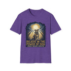 Believe in the Power Pitbull Clouds T-Shirt in heather purple, flat lay, featuring a dramatic illustrated graphic of a brindle Pitbull standing before a burst of heavenly light breaking through storm clouds, with text reading Believe in the Power of Dog and Strength, Resilience, Redemption.