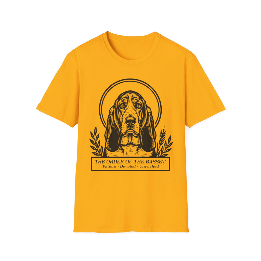 Holy Orders | Basset Hound T-Shirt flat lay on white shirt featuring a stained glass style illustration of a Basset Hound depicted as a holy figure with a golden halo and the text 'Holy Orders.'