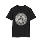 Saint Noodles Guide Us T-Shirt flat lay in black, featuring a vintage medallion graphic of a basset hound standing upright holding a staff with a fish, alongside a small child, with the text 'Saint Noodles Guide Us'.