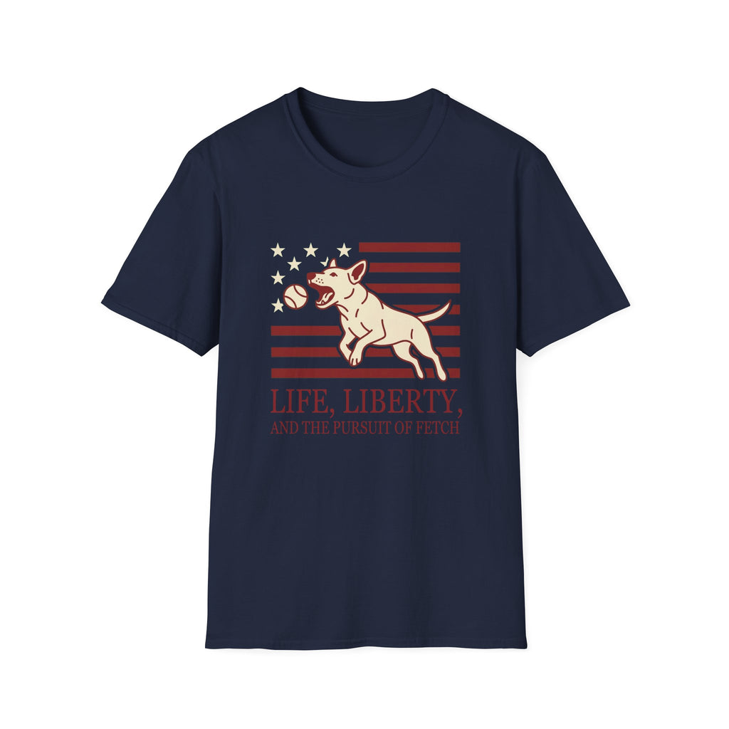 Pursuit of Fetch T-Shirt flat lay in navy blue, featuring a leaping dog catching a tennis ball over a flag of red stripes and stars, with text reading 'Life, Liberty, and the Pursuit of Fetch.'