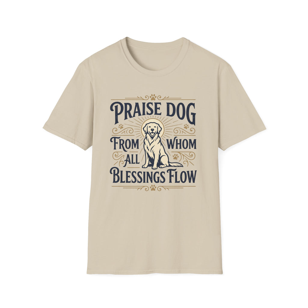 Praise Dog From Whom All Blessings Flow Golden Retriever T-Shirt flat lay in natural tan, featuring a vintage-style graphic of a seated golden retriever with a glowing halo, surrounded by ornate scroll flourishes and paw print accents.