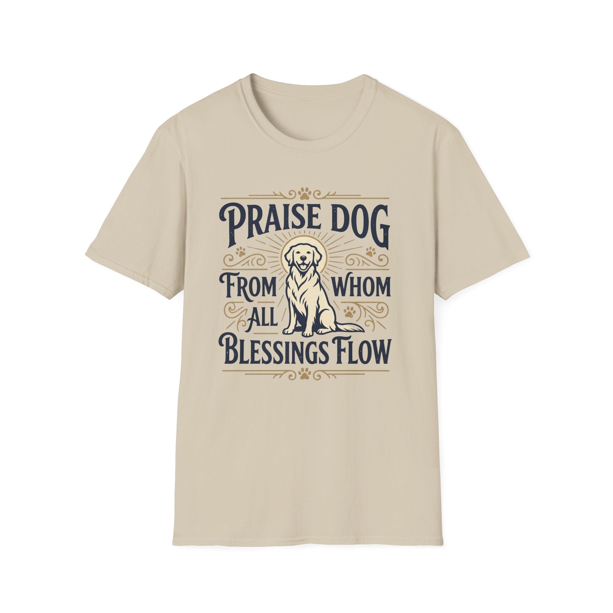 Praise Dog From Whom All Blessings Flow Golden Retriever T-Shirt flat lay in natural tan, featuring a vintage-style graphic of a seated golden retriever with a glowing halo, surrounded by ornate scroll flourishes and paw print accents.