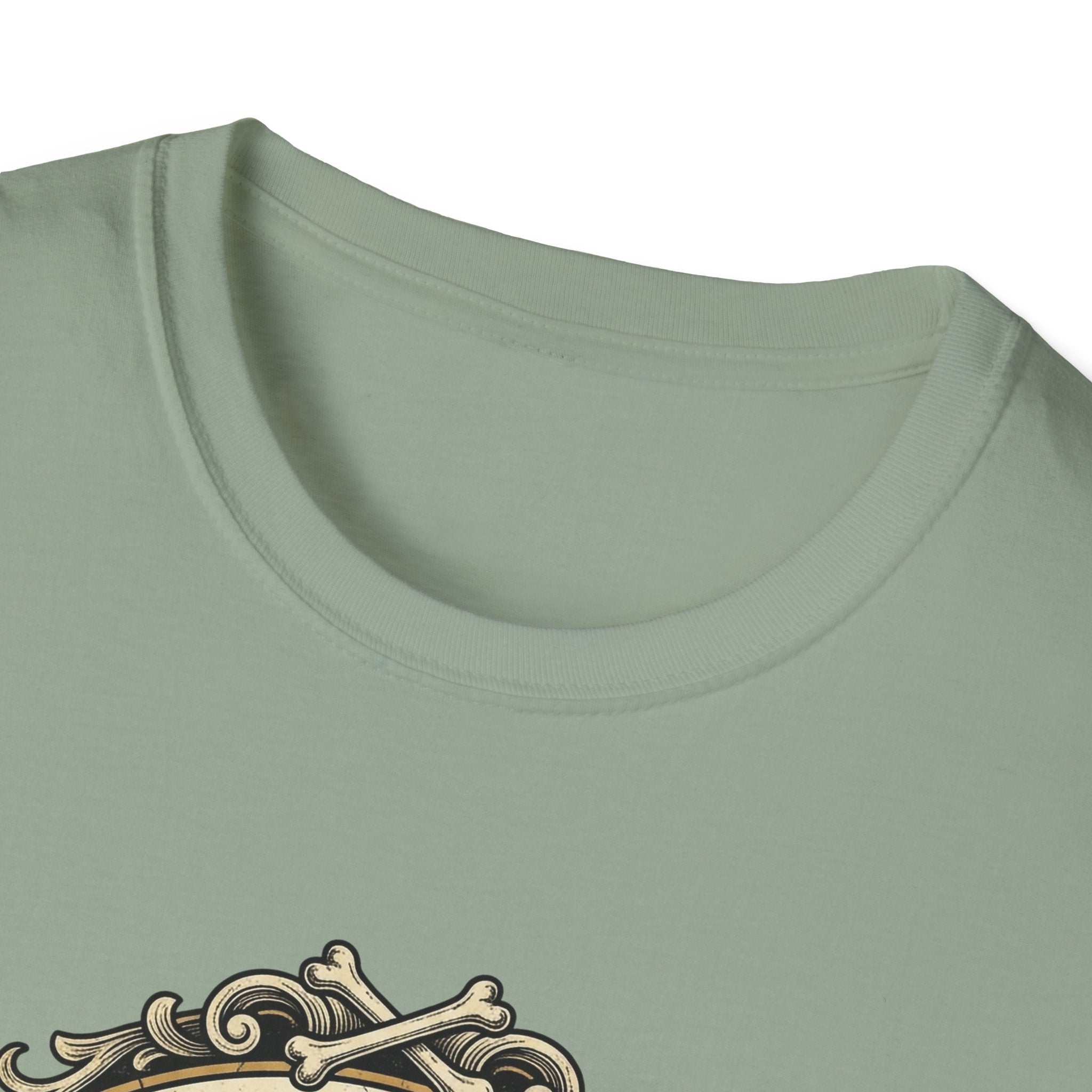 What Would Dog Do T-Shirt close-up detail shot on sage green shirt showing the neckline and the ornate vintage frame with crossed dog bones graphic.