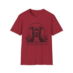 Holy Orders | Pitbull T-Shirt flat lay on black shirt featuring a stained glass style illustration of a Pitbull depicted as a holy figure with a golden halo and the text 'Holy Orders.'