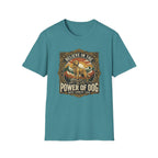 Believe in the Power of Dog T-shirt flat lay in heather teal, featuring a vintage ornate badge graphic of a Labrador standing on a rocky mountain outcrop at sunset, with the text 'Believe in the Power of Dog' and 'Faith, Loyalty, Love'.