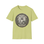 Saint Pretzel Forgive Us T-Shirt flat lay on light green shirt featuring an engraved medallion design with a French Bulldog saint and the text St. Pretzel Forgive Us.