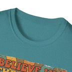 Believe in the Power of Dog Retro T-Shirt close-up detail in heather teal, showing the collar and top edge of the retro rainbow and groovy text graphic.
