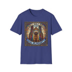 Holy Holy Holy St Bernard T-Shirt flat lay on royal blue, featuring a stained-glass-style illustration of a St Bernard seated before cathedral arches with the text 'Holy Holy Holy Lord Dog Almighty'.