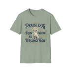 Praise Dog From Whom All Blessings Flow Golden Retriever T-Shirt flat lay in sage green, featuring a vintage-style graphic of a seated golden retriever with a glowing halo, surrounded by ornate scroll flourishes and paw print accents.