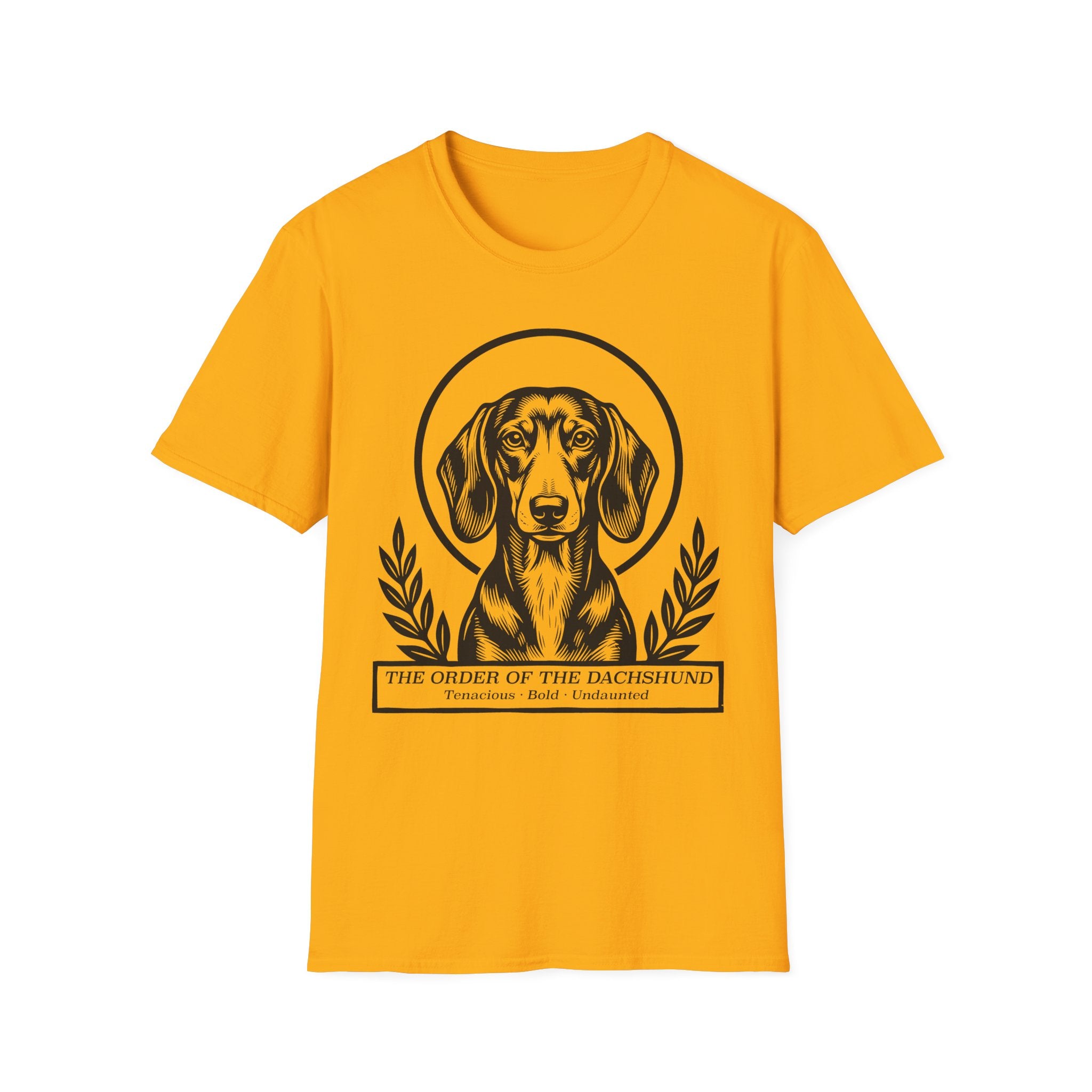 Holy Orders | Dachshund T-Shirt flat lay on sage green shirt featuring a stained glass style illustration of a Dachshund depicted as a holy figure with a golden halo and the text 'Holy Orders.'