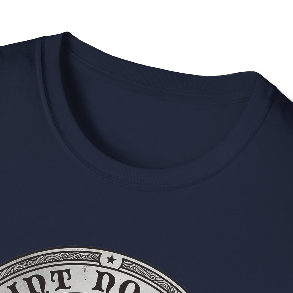 Saint Noodles Guide Us T-Shirt close-up detail on navy blue shirt showing the circular border and top portion of the basset hound Saint Noodles medallion graphic.