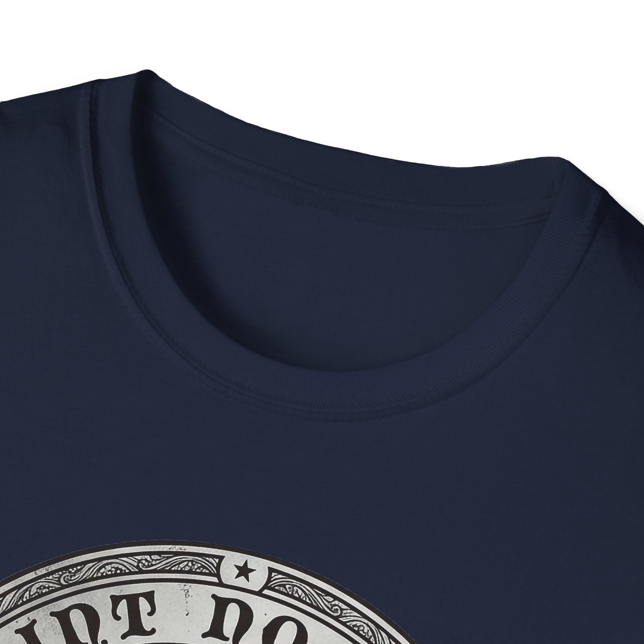 Saint Noodles Guide Us T-Shirt close-up detail on navy blue shirt showing the circular border and top portion of the basset hound Saint Noodles medallion graphic.