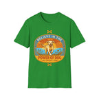 Believe in the Power of Dog Yellow Lab T-Shirt in kelly green, flat lay view showing a retro-style oval badge with a halo-wearing yellow Labrador running joyfully through a sunlit field, with the words 'Joy Loyalty Love' and crossed bones.