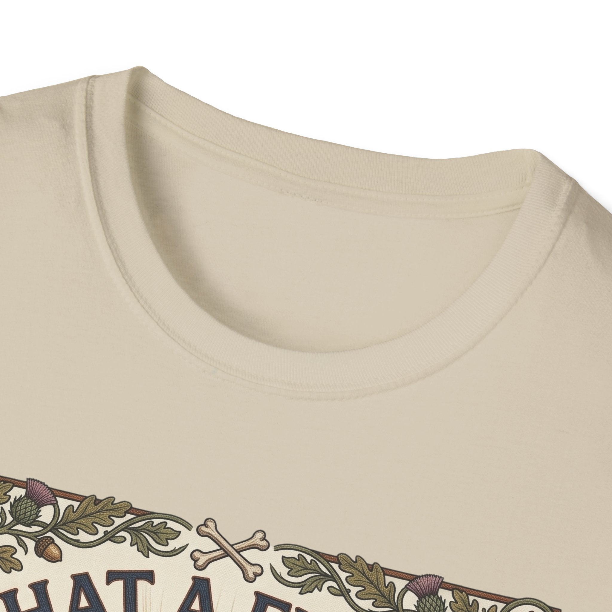 What a Friend We Have in Dog T-Shirt close-up detail shot on a natural tan shirt, showing the vintage botanical border with crossbones and floral motifs at the neckline.