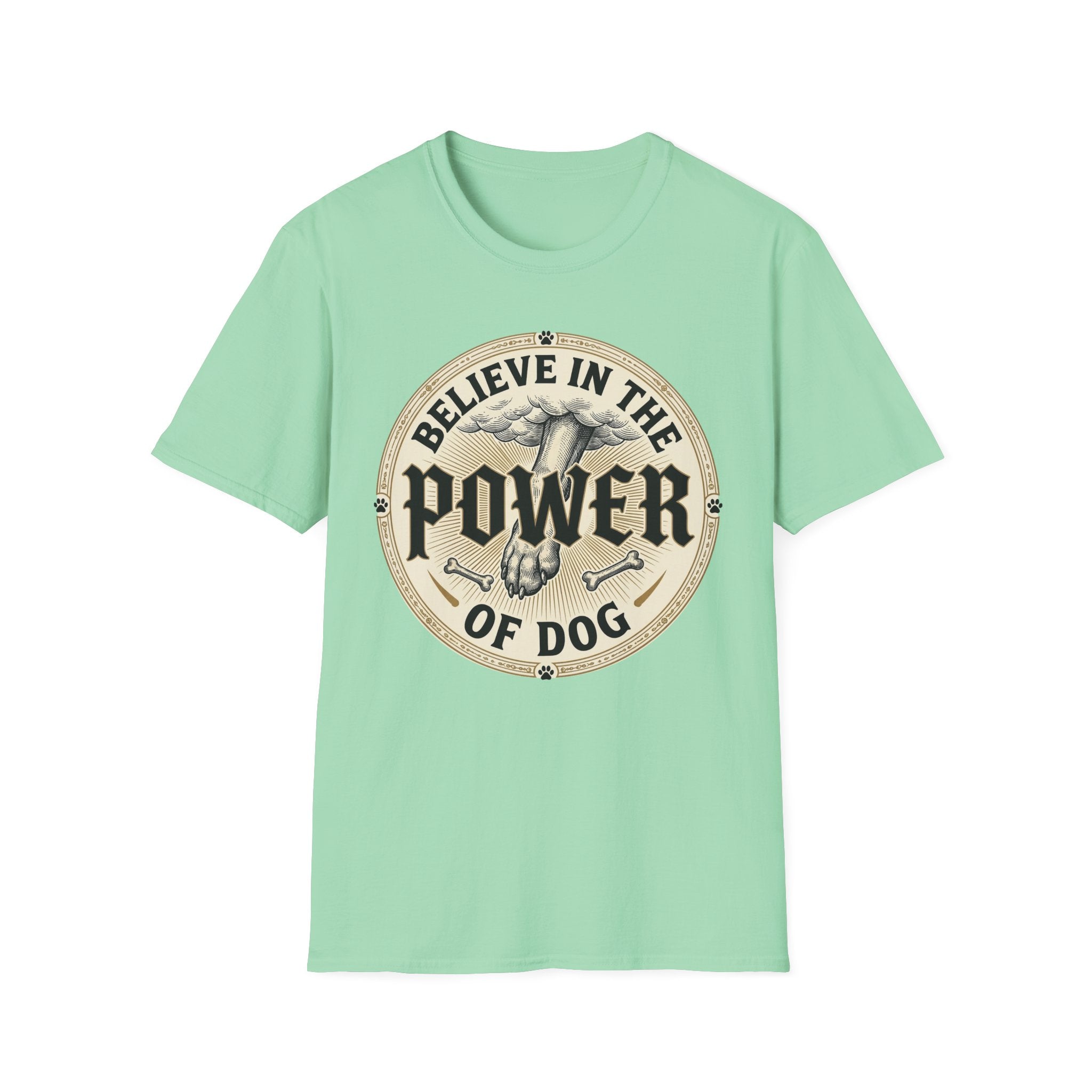 Believe in the Power of Dog Paw T-shirt flat lay in mint green, featuring a circular vintage badge graphic of a dog paw raised like a fist from clouds above crossed bones, with paw print accents and bold text.