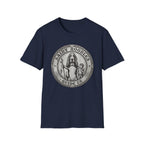 Saint Noodles Guide Us T-Shirt flat lay in navy blue, featuring a vintage medallion graphic of a basset hound standing upright holding a staff with a fish, alongside a small child, with the text 'Saint Noodles Guide Us'.