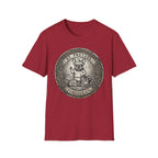 Saint Pretzel Forgive Us T-Shirt flat lay on crimson red shirt featuring an engraved medallion design with a French Bulldog saint and the text St. Pretzel Forgive Us.