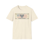 In Dog We Trust Bill T-Shirt flat lay in natural/cream, featuring a currency-style graphic of a dog portrait with a halo set against a vintage American flag, printed with the text 'In Dog We Trust.'