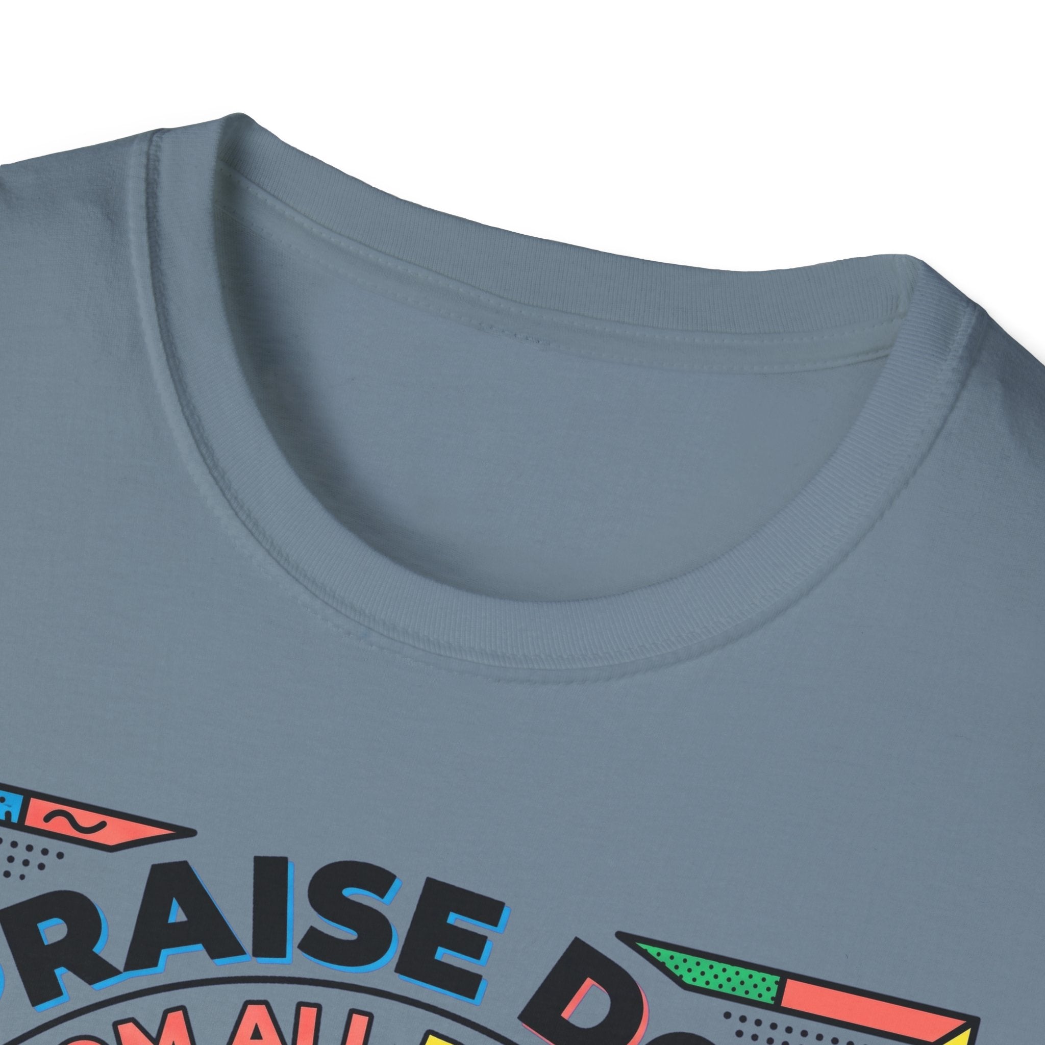 Praise Dog From Whom All Blessings Flow Geometric T-Shirt close-up detail of the collar area on a slate blue shirt, showing the colorful pop-art border of the Praise Dog graphic.