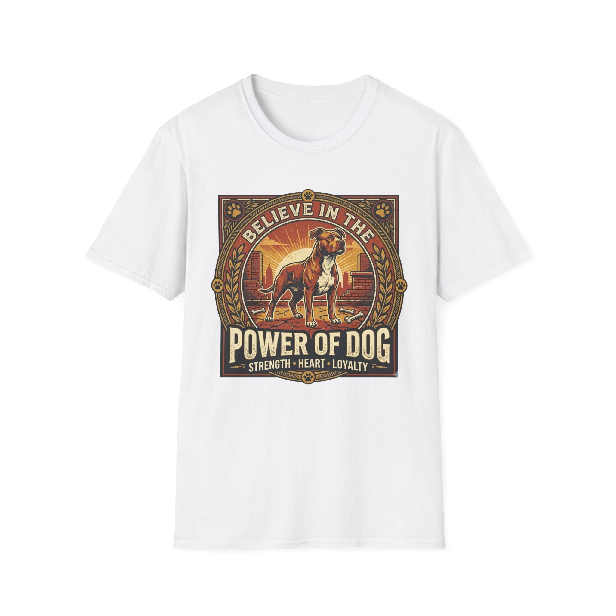 Believe in the Power of Dog Pitbull Cityscape T-Shirt in white, flat lay, featuring a retro-style badge graphic of a muscular brown and white Pitbull standing proudly before a warm urban cityscape at sunset, with text reading Believe in the Power of Dog and Strength, Heart, Loyalty.