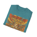 Believe in the Power of Dog Retro T-Shirt folded flat lay in heather teal, showing the vintage 70s graphic of a fluffy dog face with rainbow rays and groovy text.