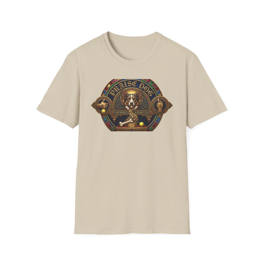 Praise Dog From Whom All Blessings Flow Corgi T-Shirt flat lay in natural tan, featuring an ornate medieval stained-glass style graphic of a regal corgi seated in a jewel-encrusted octagonal frame with gold gothic lettering and dog bone and tennis ball accents.