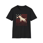 Pursuit of Fetch T-Shirt flat lay in black, featuring a leaping dog catching a tennis ball over a flag of red stripes and stars, with text reading 'Life, Liberty, and the Pursuit of Fetch.'