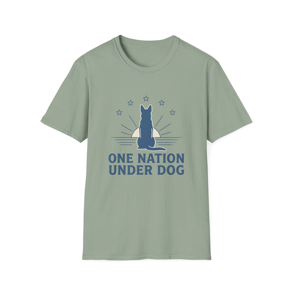 One Nation Under Dog T-Shirt flat lay in sage green, featuring a blue dog silhouette seated before a rising sun with rays and surrounding stars, with bold text reading 'One Nation Under Dog.'