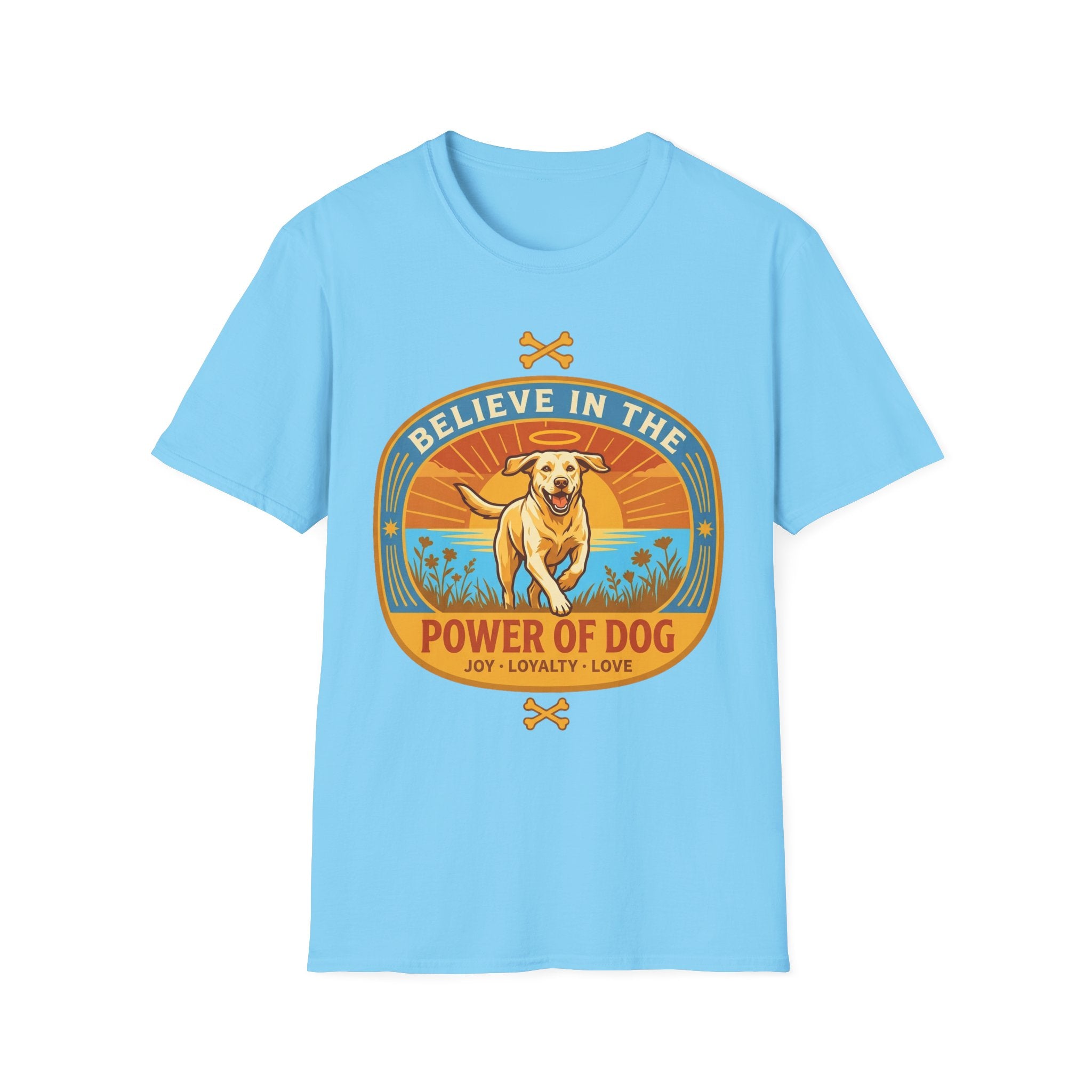 Believe in the Power of Dog Yellow Lab T-Shirt in light blue, flat lay view showing a retro-style oval badge with a halo-wearing yellow Labrador running joyfully through a sunlit field, with the words 'Joy Loyalty Love' and crossed bones.