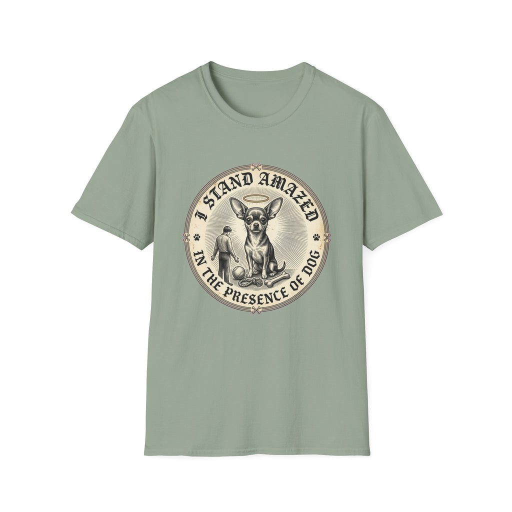 I Stand Amazed Chihuahua T-Shirt in sage green, flat lay front view featuring a vintage-style circular graphic of a Chihuahua with a halo seated above a small human figure bowing in reverence, with the text 'I Stand Amazed in the Presence of Dog.'