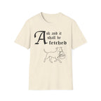 Pitbull Ask and It Shall Be Fetched T-Shirt flat lay on black shirt featuring a Shel Silverstein-style pen-and-ink illustration of a Pitbull proudly trotting with a baby in a reed basket and the text 'Ask and it shall be fetched.'