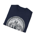 Saint Biscuit Heal Us T-shirt folded flat lay in navy blue, showing the 'Saint Biscuit' medallion graphic with a golden retriever comforting a reclining figure.