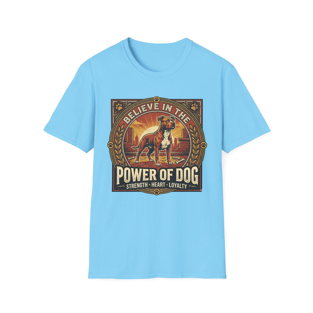 Believe in the Power of Dog Pitbull Cityscape T-Shirt in light blue, flat lay, featuring a retro-style badge graphic of a muscular brown and white Pitbull standing proudly before a warm urban cityscape at sunset, with text reading Believe in the Power of Dog and Strength, Heart, Loyalty.