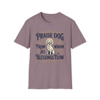 Praise Dog From Whom All Blessings Flow Golden Retriever T-Shirt flat lay in dusty mauve, featuring a vintage-style graphic of a seated golden retriever with a glowing halo, surrounded by ornate scroll flourishes and paw print accents.