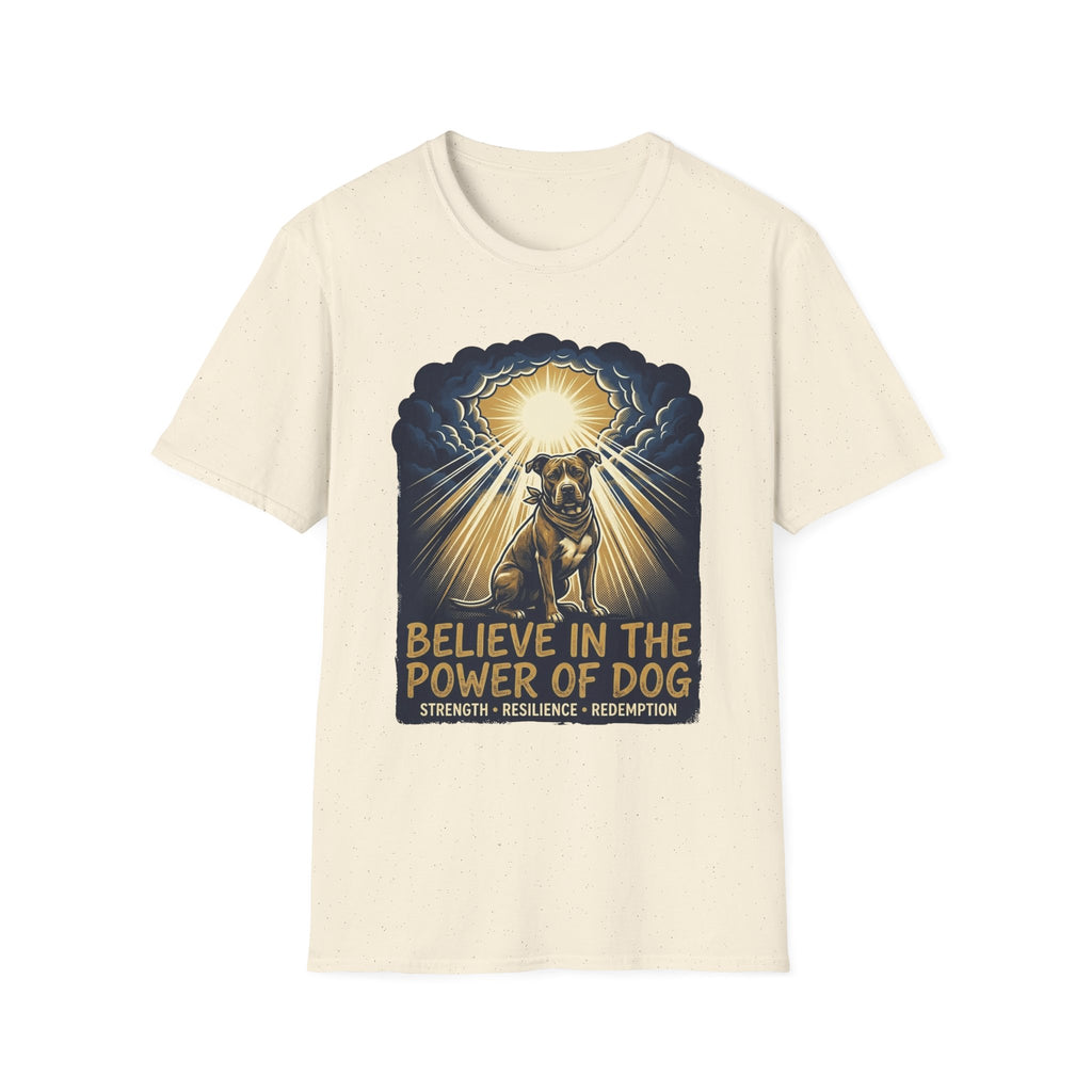 Believe in the Power Pitbull Clouds T-Shirt in natural cream, flat lay, featuring a dramatic illustrated graphic of a brindle Pitbull standing before a burst of heavenly light breaking through storm clouds, with text reading Believe in the Power of Dog and Strength, Resilience, Redemption.