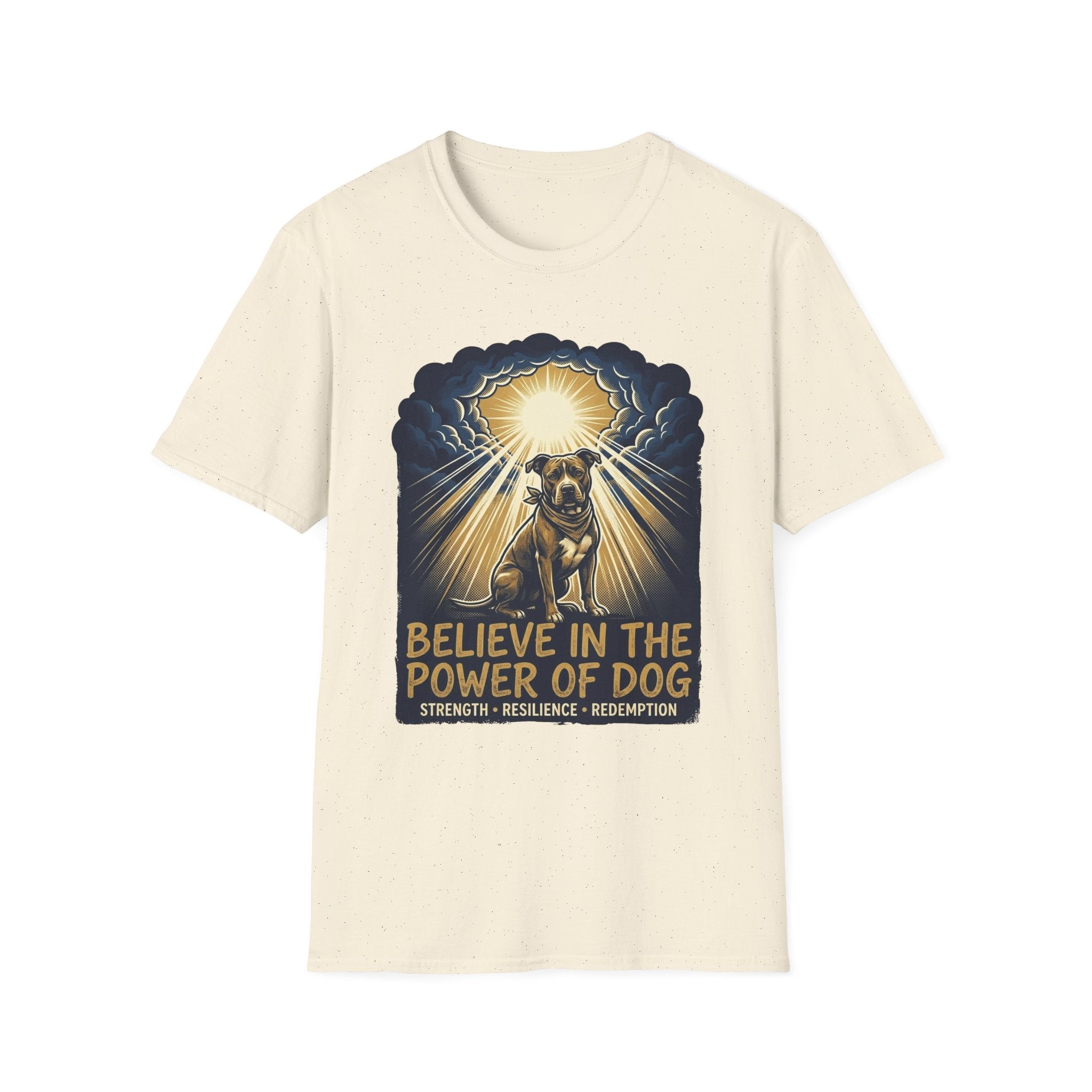 Believe in the Power Pitbull Clouds T-Shirt in natural cream, flat lay, featuring a dramatic illustrated graphic of a brindle Pitbull standing before a burst of heavenly light breaking through storm clouds, with text reading Believe in the Power of Dog and Strength, Resilience, Redemption.