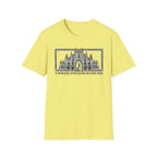 A Mighty Fortress is Our Dog T-Shirt flat lay in yellow featuring a detailed gothic cathedral illustration with a dog standing in the doorway, framed in an ornate border with text below.