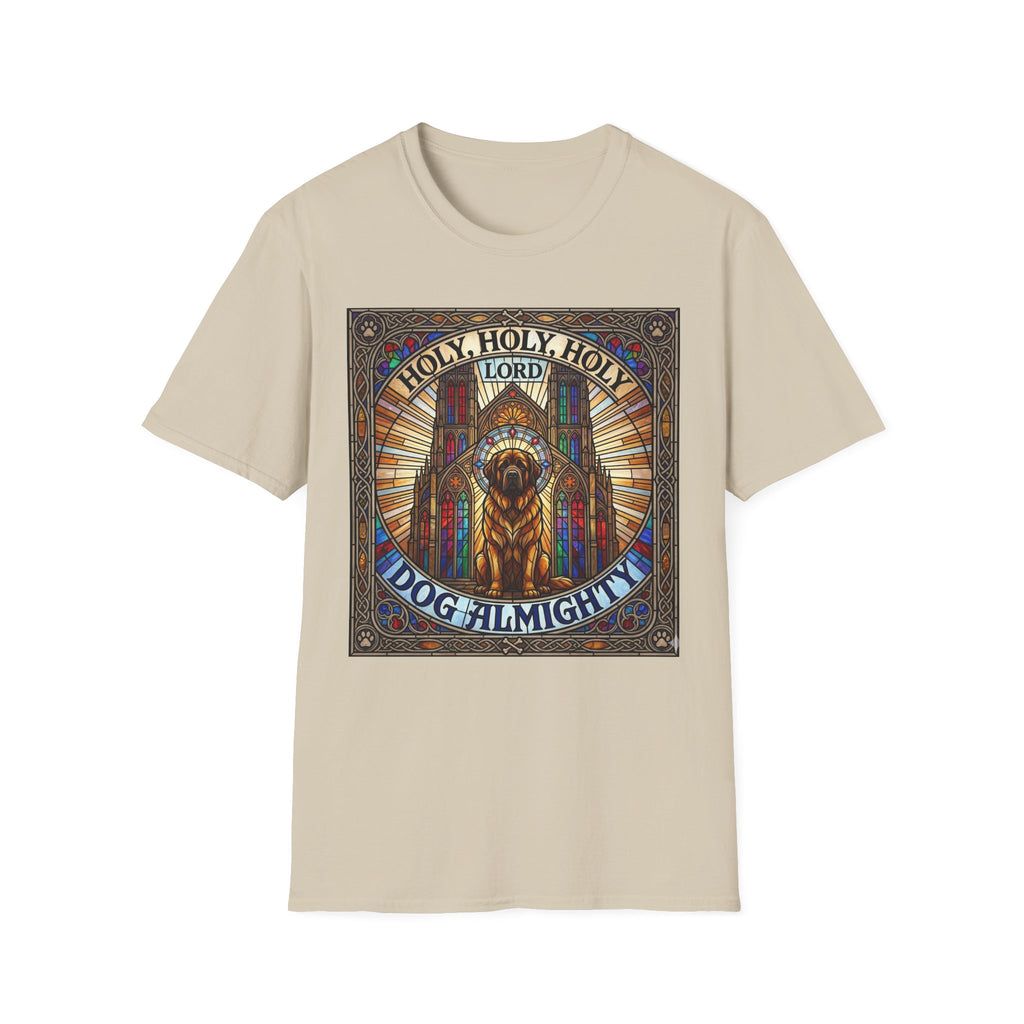 Holy Holy Holy St Bernard T-Shirt flat lay on sand, featuring a stained-glass-style illustration of a St Bernard seated before cathedral arches with the text 'Holy Holy Holy Lord Dog Almighty'.