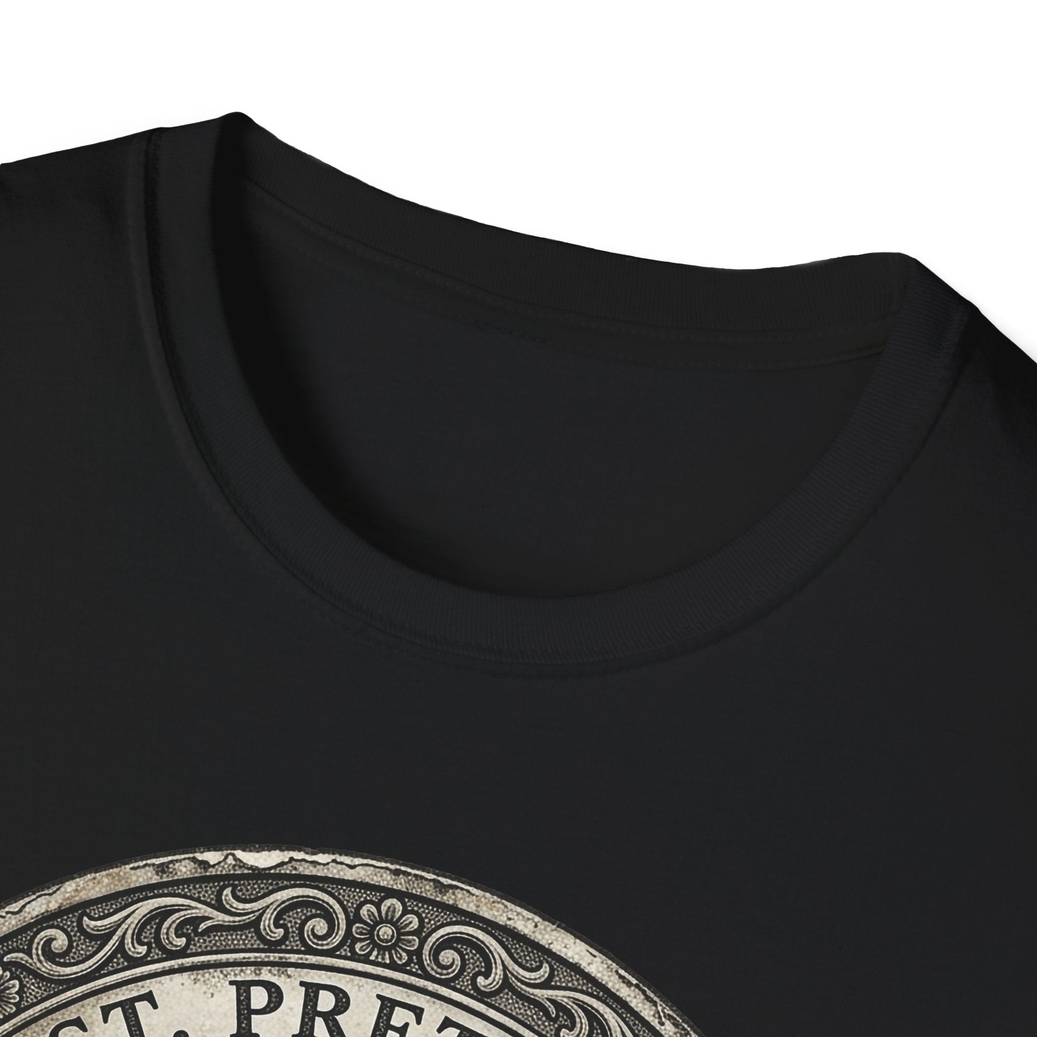 Saint Pretzel Forgive Us T-Shirt close-up detail shot on black shirt showing the neckline and top portion of the St. Pretzel engraved medallion graphic.