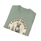 I Stand Amazed Pitbull T-Shirt in sage green, folded view showing the front graphic of the pitbull design with halo and 'I Stand Amazed' text.