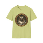 Let Go Let Dog Pug T-Shirt flat lay on sage green, featuring an ornate gold-framed medallion with a halo-wearing pug raising its paws and the text 'Let Go and Let Dog'.