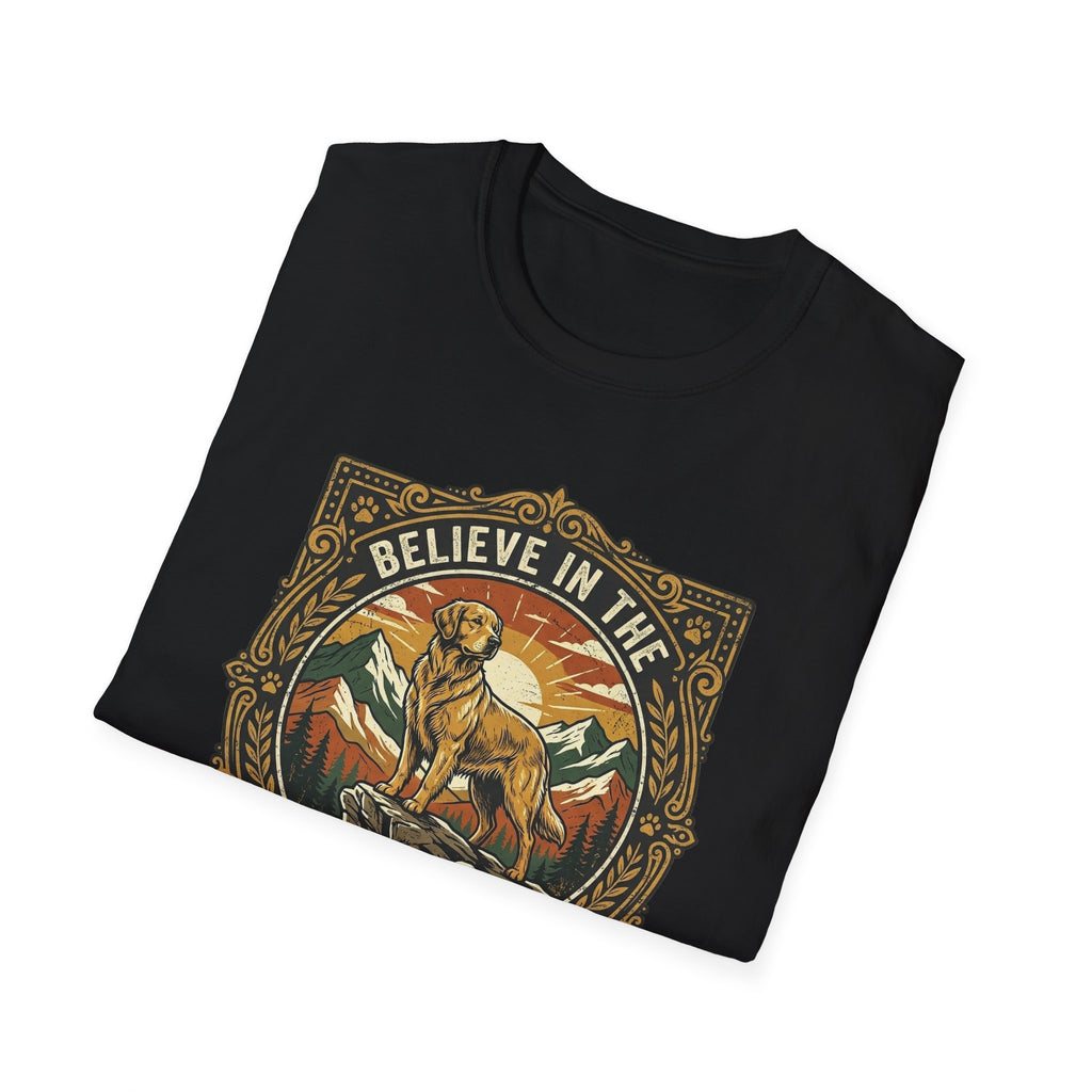 Believe in the Power of Dog T-shirt folded flat lay in black, showing the ornate vintage badge graphic of a Labrador on a rocky mountain outcrop with 'Believe in the' arched text at top.