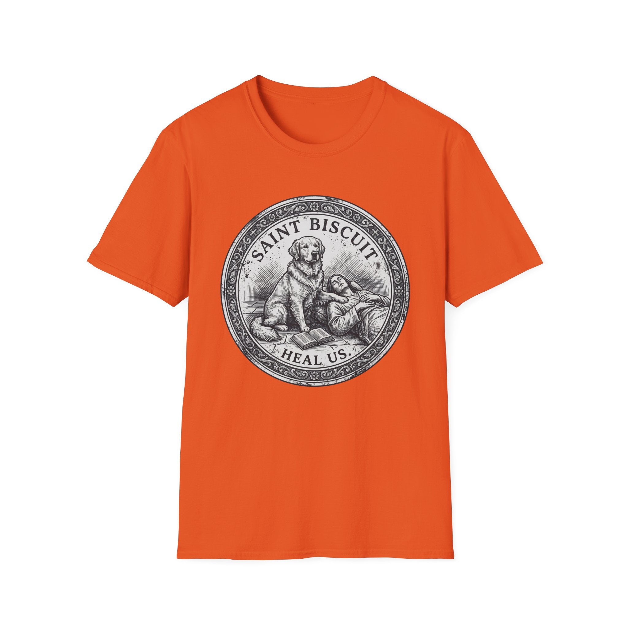 Saint Biscuit Heal Us T-shirt flat lay in orange, featuring a vintage-style medallion graphic of a golden retriever dog watching over a reclining figure with the text 'Saint Biscuit Heal Us'.