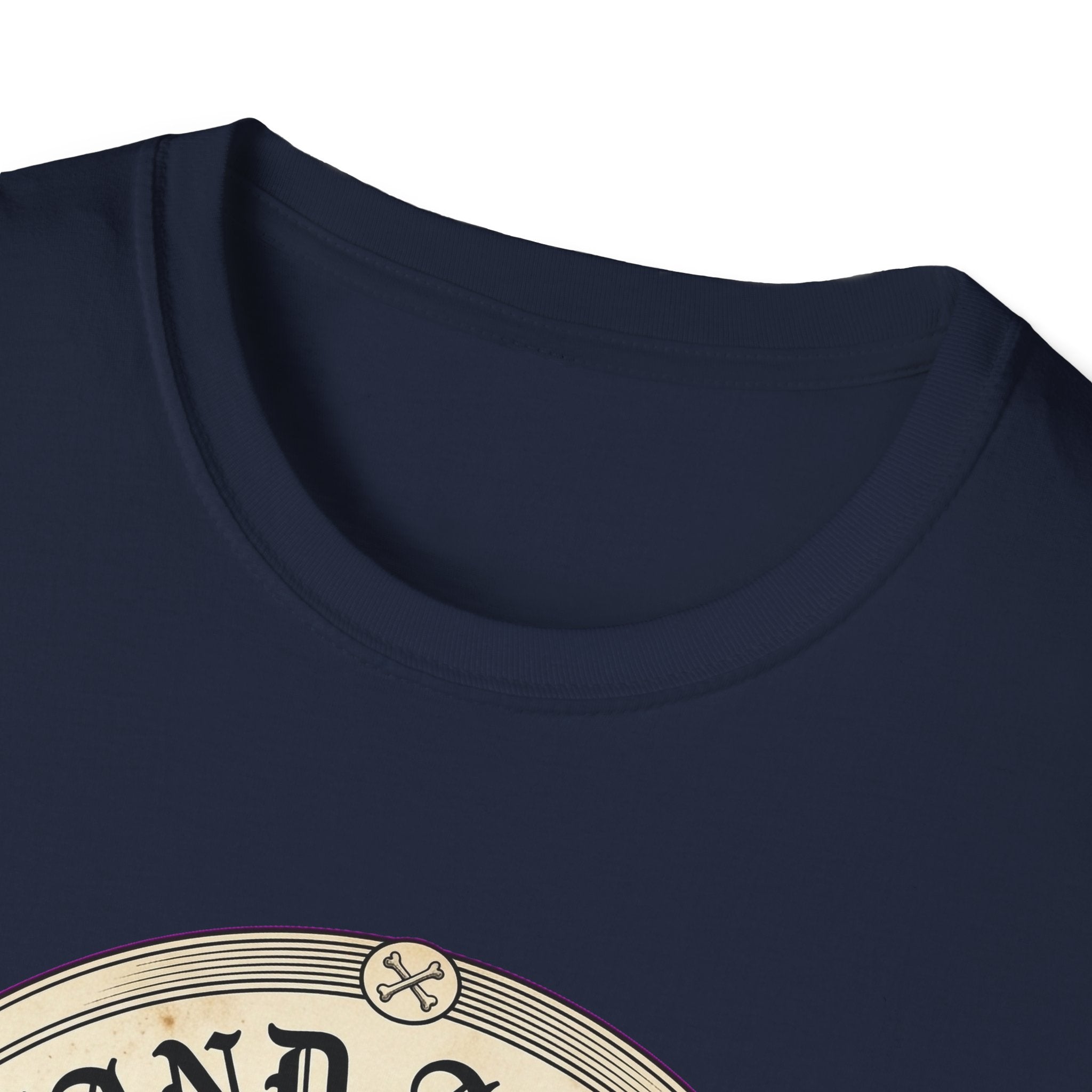 I Stand Amazed Rescue Mutt T-Shirt in navy, close-up of the neckline and upper graphic detail showing the circular rescue mutt design with crossed-bone medallion and vintage lettering.
