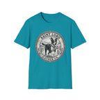 Saint Lobo Gather Us T-Shirt flat lay in teal, featuring a vintage medallion graphic of a leaping border collie-style dog with a halo, surrounded by the text 'Saint Lobo — Gather Us.'