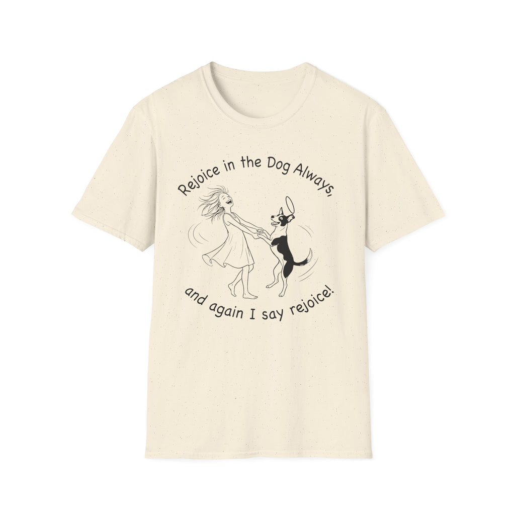 Rejoice in the Dog T-Shirt in natural cream, flat lay, featuring a playful line drawing of a woman joyfully dancing with a leaping dog and the text 'Rejoice in the Dog Always, and again I say rejoice!'