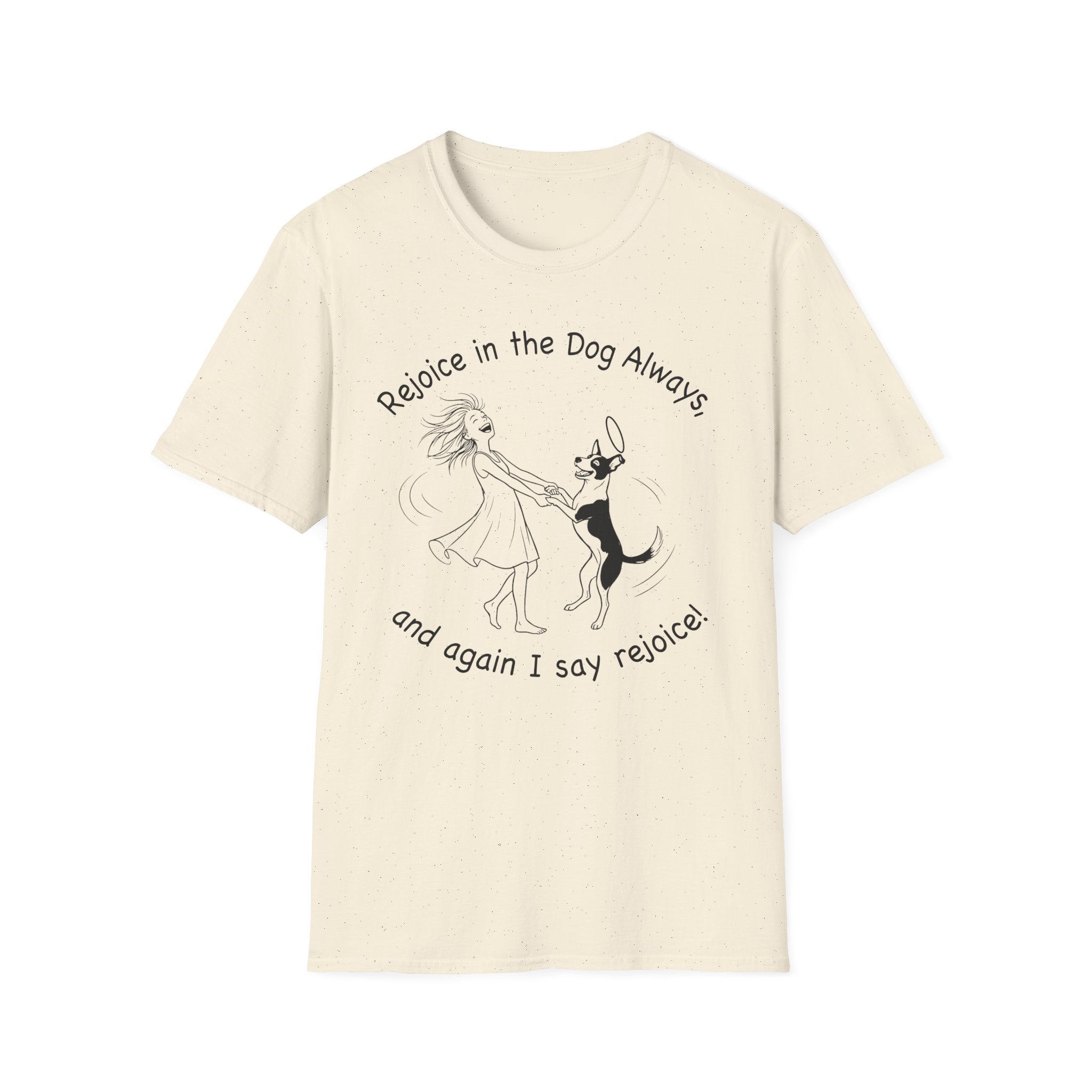 Rejoice in the Dog T-Shirt in natural cream, flat lay, featuring a playful line drawing of a woman joyfully dancing with a leaping dog and the text 'Rejoice in the Dog Always, and again I say rejoice!'
