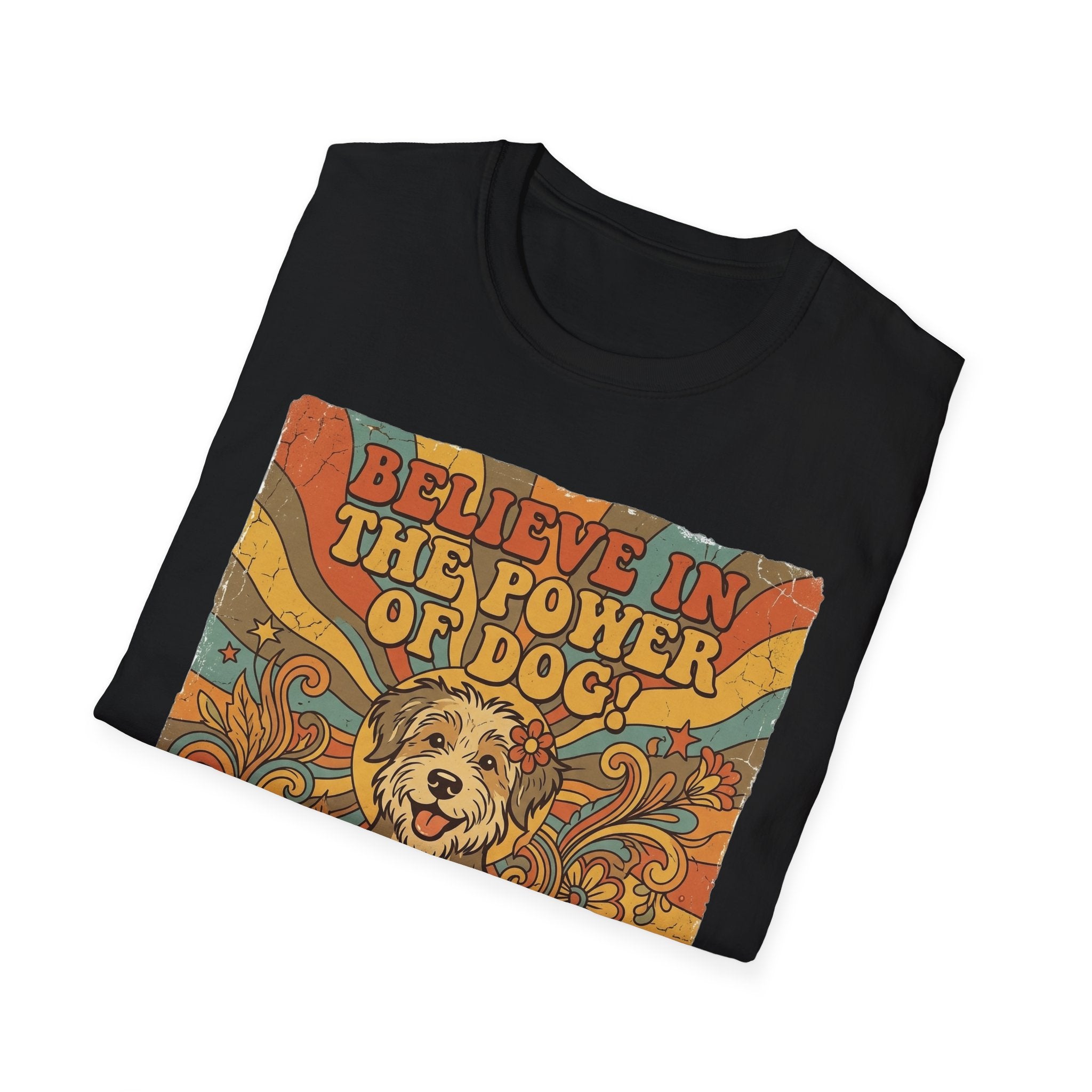 Believe in the Power of Dog Retro T-Shirt folded flat lay in black, showing the vintage 70s graphic of a fluffy dog face with rainbow rays and groovy text.