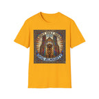 Holy Holy Holy St Bernard T-Shirt flat lay on gold, featuring a stained-glass-style illustration of a St Bernard seated before cathedral arches with the text 'Holy Holy Holy Lord Dog Almighty'.